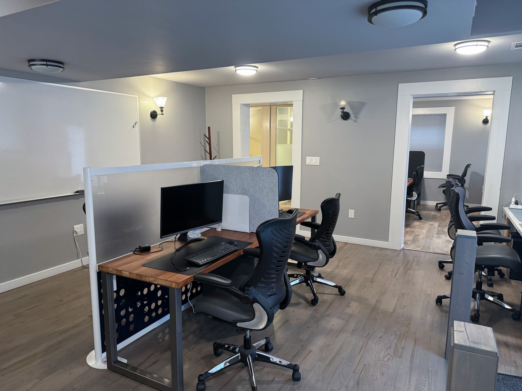 Work area in the building with wood desks and charcoal storage